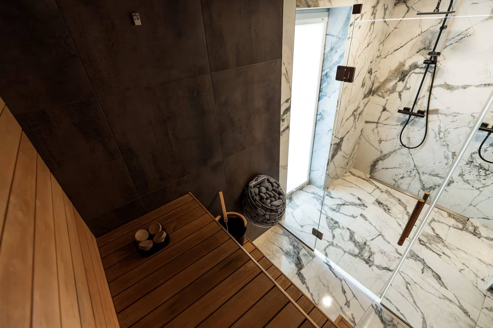 Matt white countertop basin on oak vanity in a sunlit bathroom